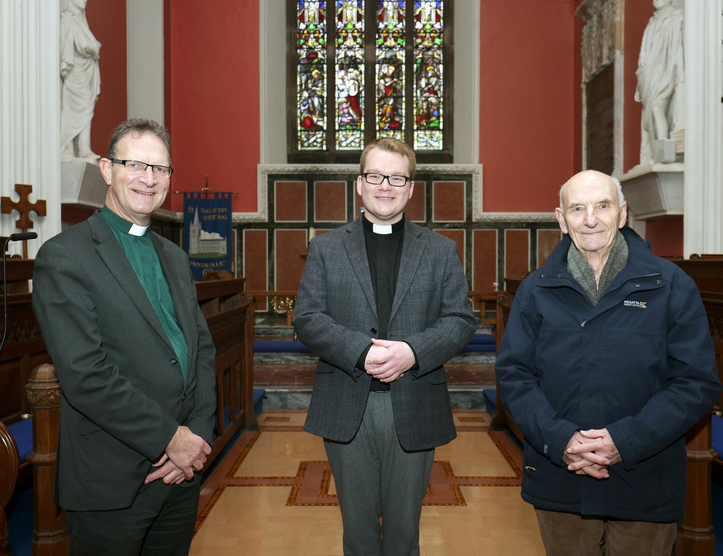 The Very Revd Dean Kenneth Hall (left), and Sam Morrow, (right), Secretary of St Macartins Cathedral Select Vestry welcomes The Rev. Chris West the new Curate to the church..