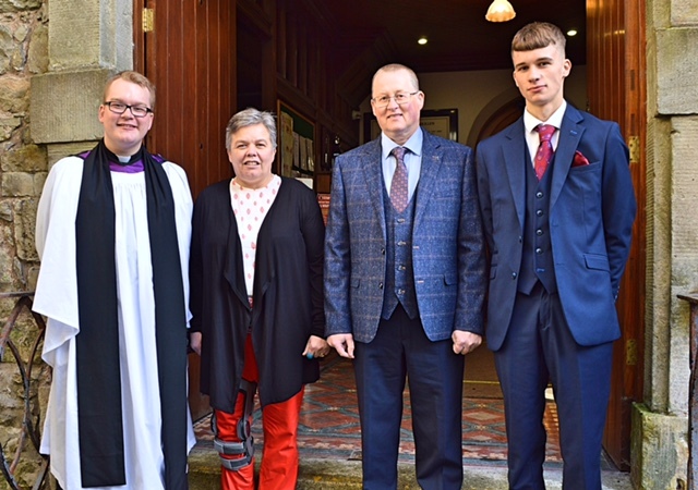 Rev. West pictured alongside his parents Nigel and Lind and his brother, Owen