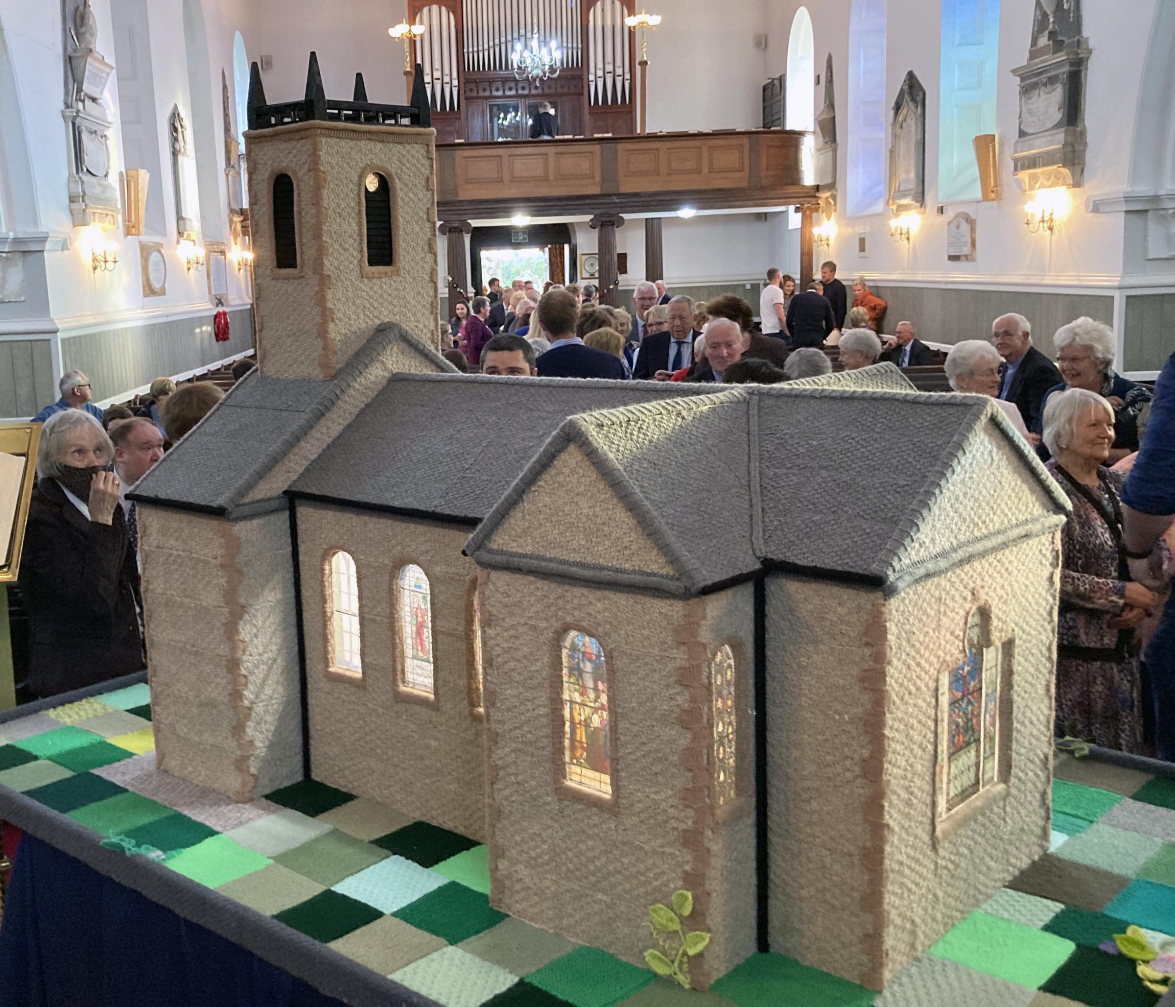 The congregation attending the Praise and Worship Service in Clogher Cathedral on Sunday night queue up to see the model unveiled during the service. Photos above: Brian Donaldson.