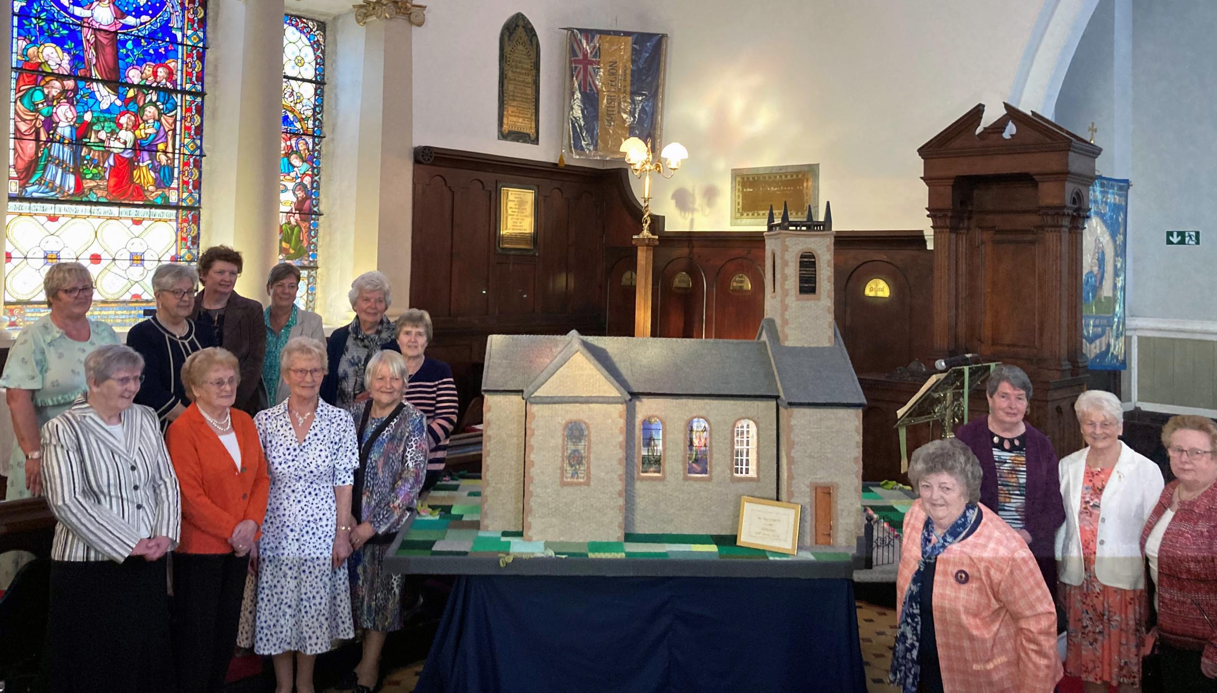 Some of the members of the Knit, Stitch and Natter group who helped to produce the model of St. Macartan’s Cathedral, Clogher, in a year-long project.