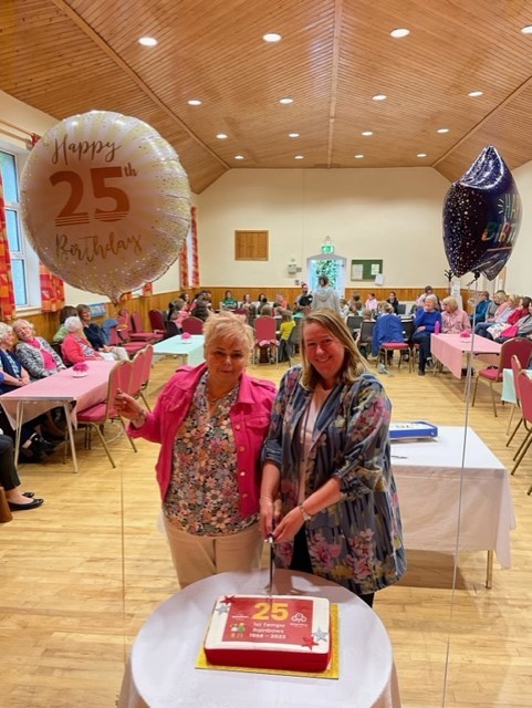 Former leaders Caroline Clarke and Sharon Woods cut the Rainbow birthday cake.