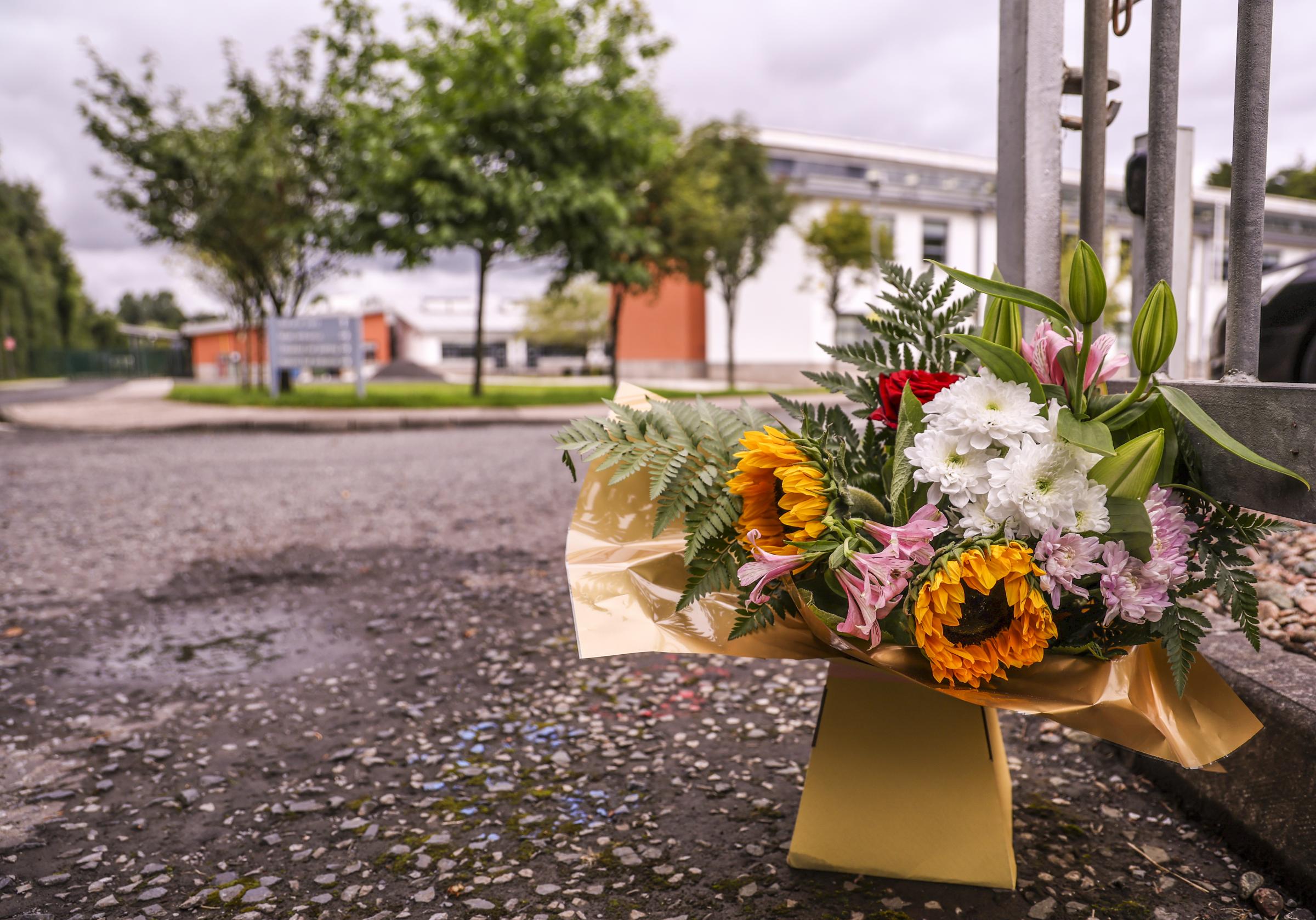 A bouquet of flowers rest at the entrance to Largy College, Clones.