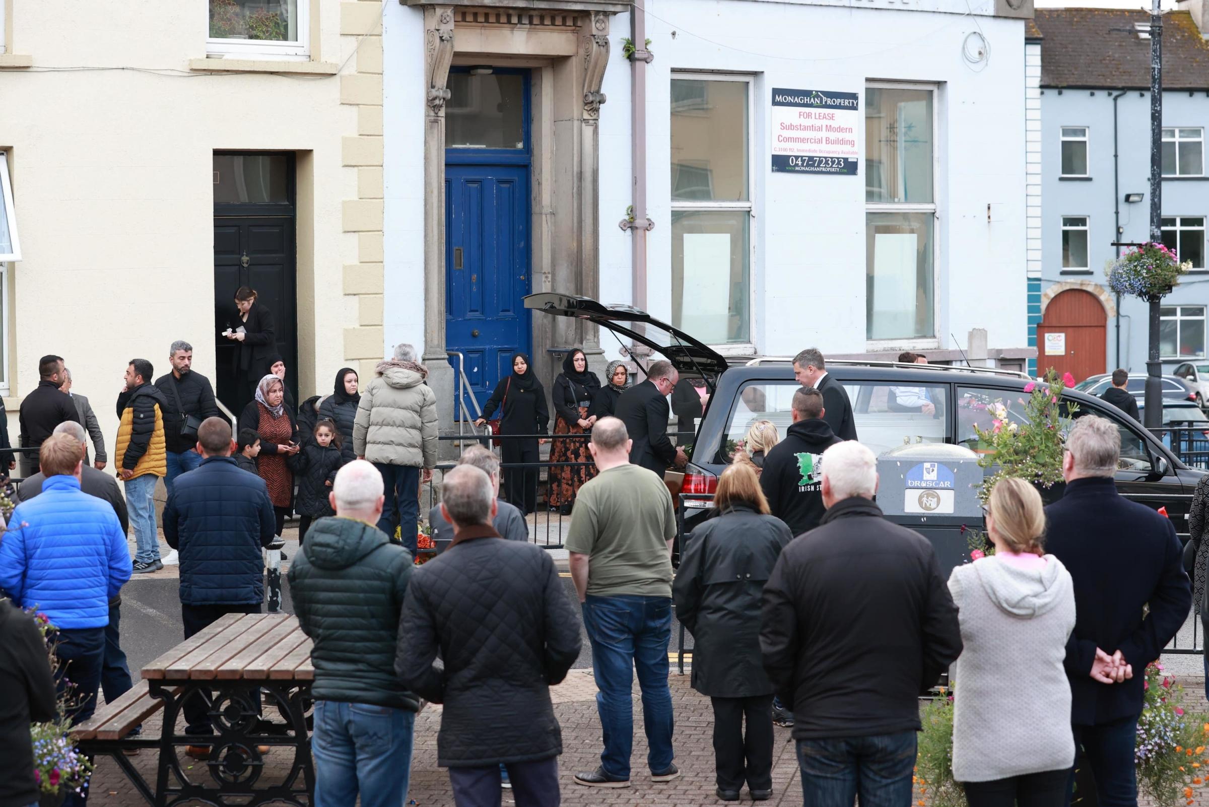 The coffin carrying Dlava Mohamed outside the family home in Clones early on Thursday (Liam McBurney/PA).