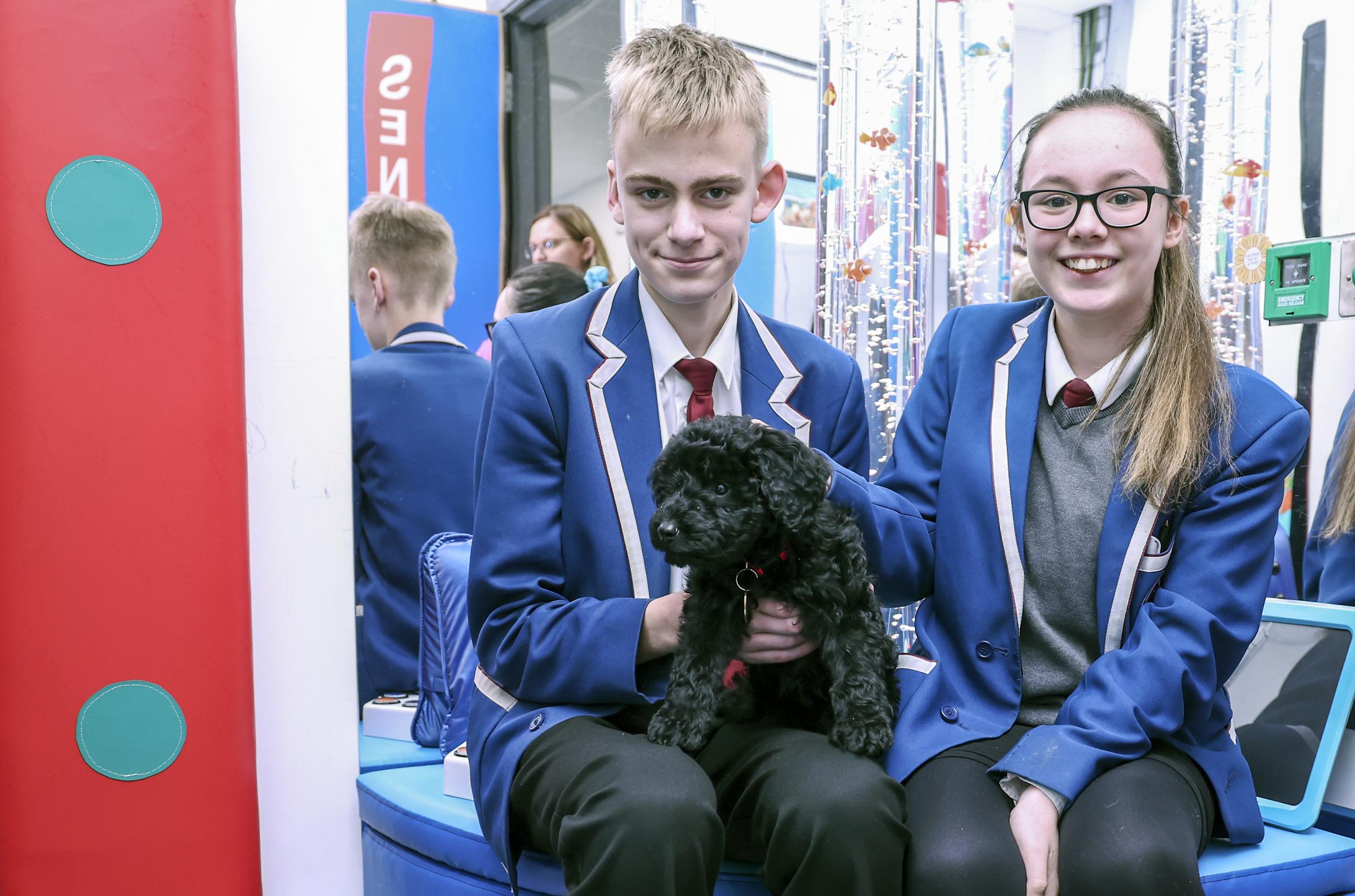 Mylo McMackin and Niamh-Avis Cassidy, getting to meet Pluto in The Sensory Room at the school.