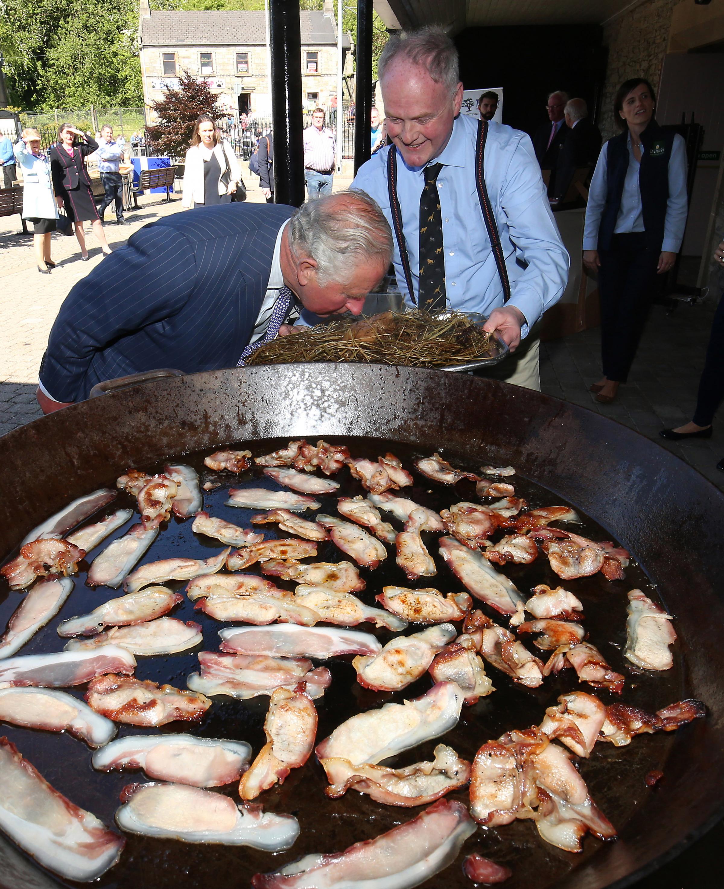 Pat ODoherty, asks Prince Charles to smell his smoked bacon during his visit to Lisnaskea. © - Picture by John McVitty - 07771987378 - ©